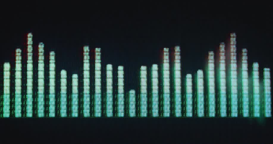 Digital sound bar graph rising up and down on a computer screen displaying the equalizer of an old vintage stereo system or hi-fi equipment with neon green light and distortion
