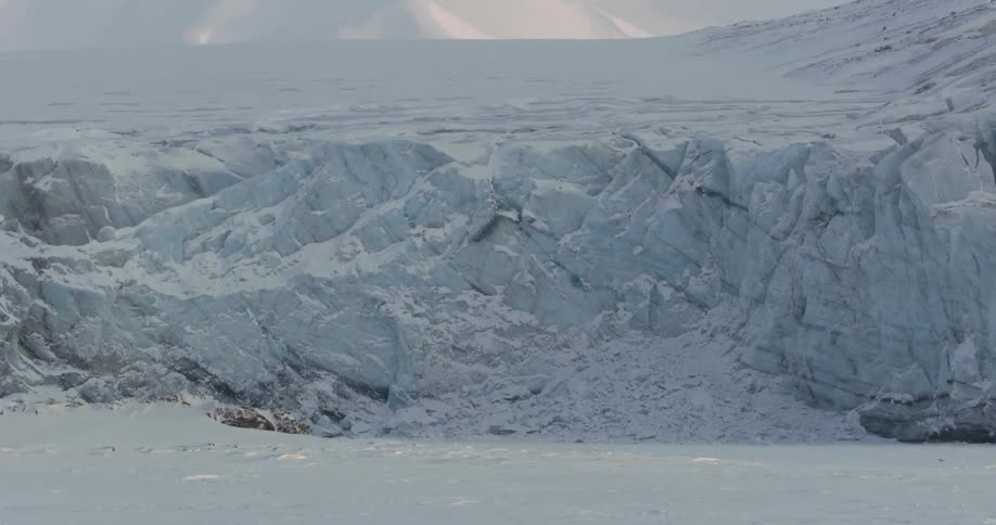 A tall ice wall ahead has a steep cliff