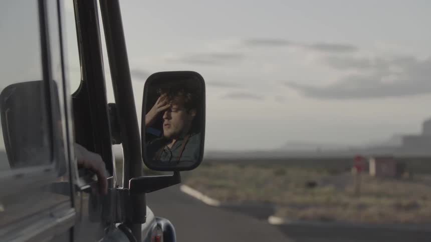 A man enters a vehicle