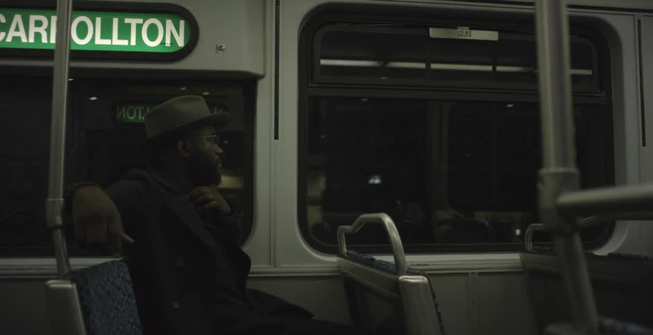 A person riding inside a train car