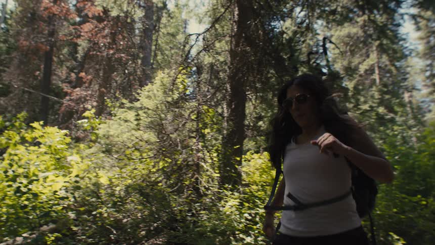 Woman running on a forest trail