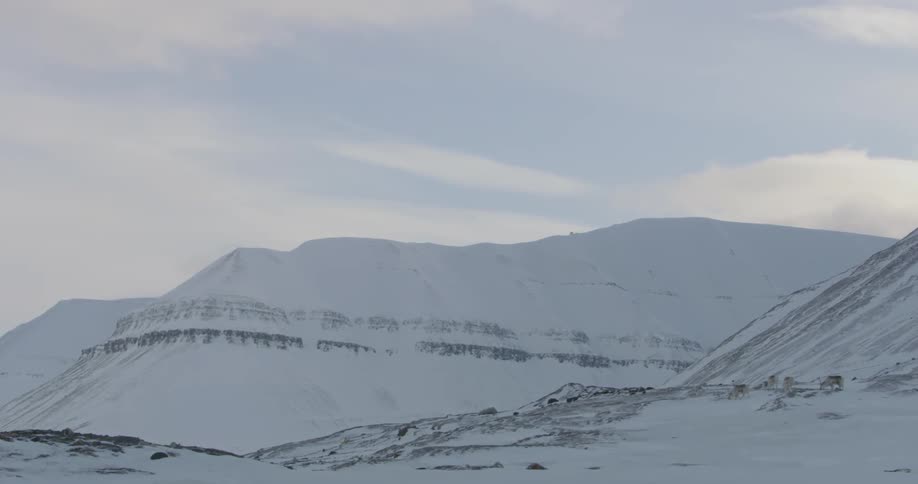 Snow lines the mountainous landscape