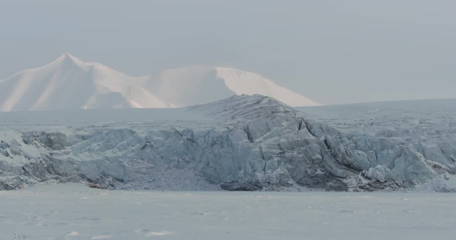 Ice and snow cover the landscape