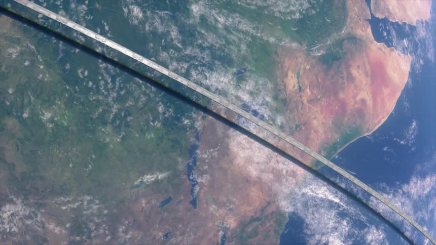 A view of earth from space shows city lights across continents and a ringlike structure encircling the planet