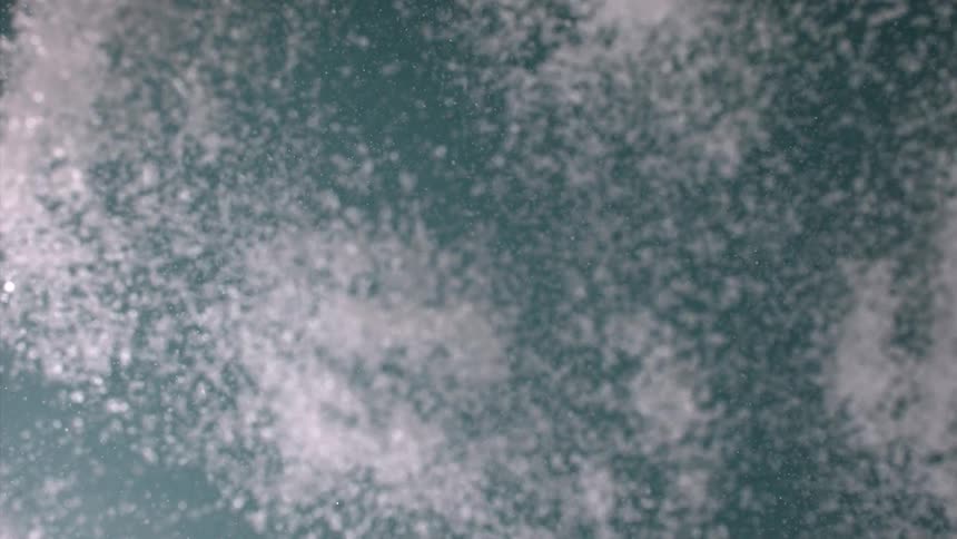Abstract white powder being sprayed