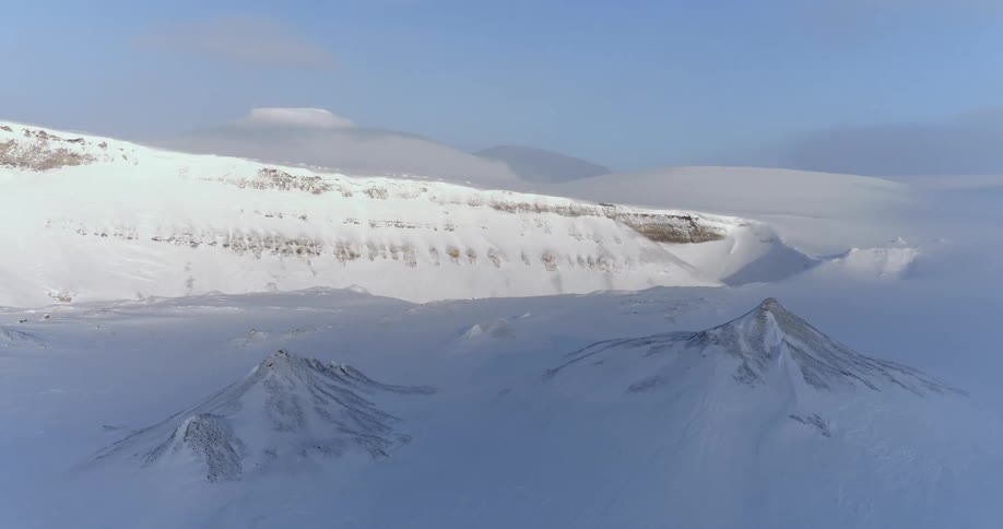 Snow and ice cover the landscape