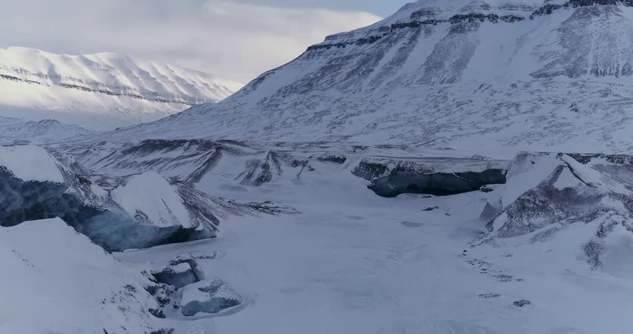 The mountain is covered with snow and ice