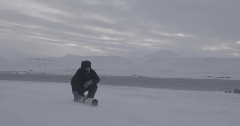 A man gets up from the ice after taking a picture