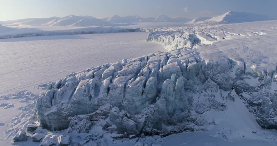 Snow-covered ridges are shown below
