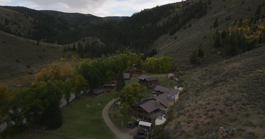 Several houses sit in the middle of a valley