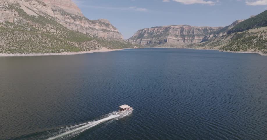 Boat sailing on a mountain valley river