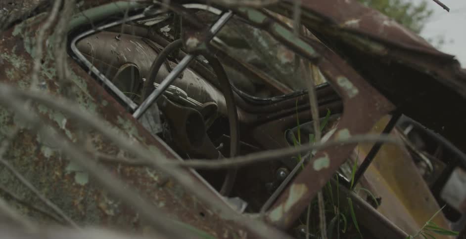 Old vehicle abandoned in a natural area