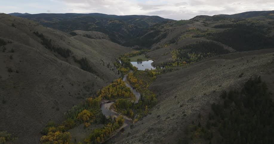 A small lake is between the hills