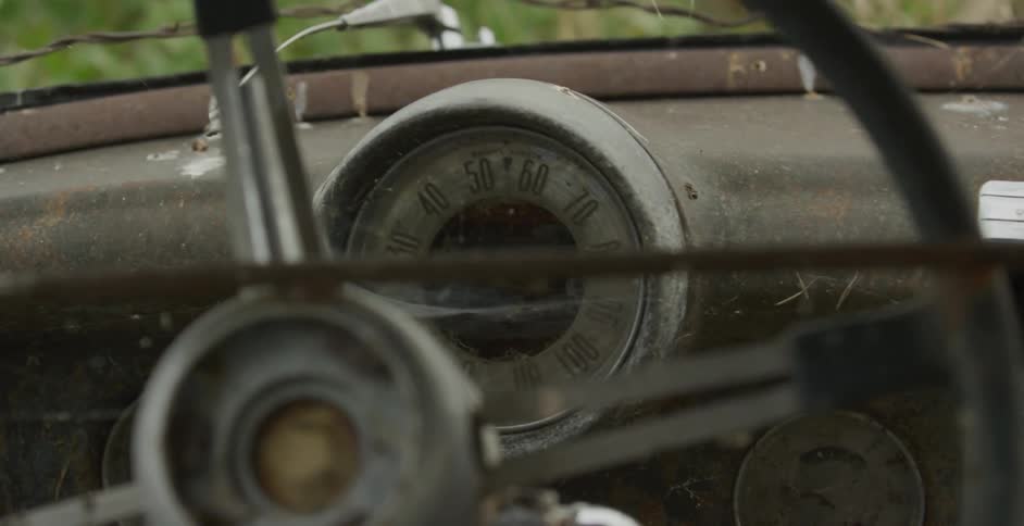 The old abandoned vehicle is rusted out
