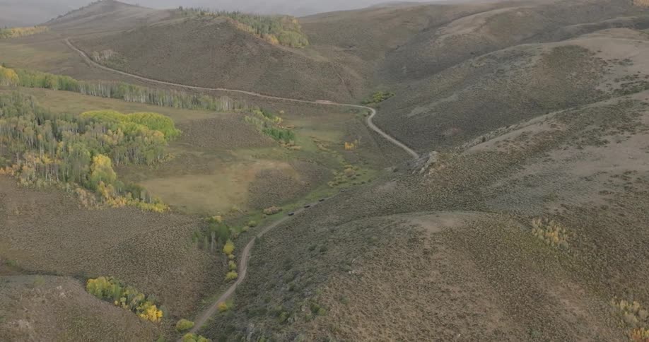 A path winds through the hills