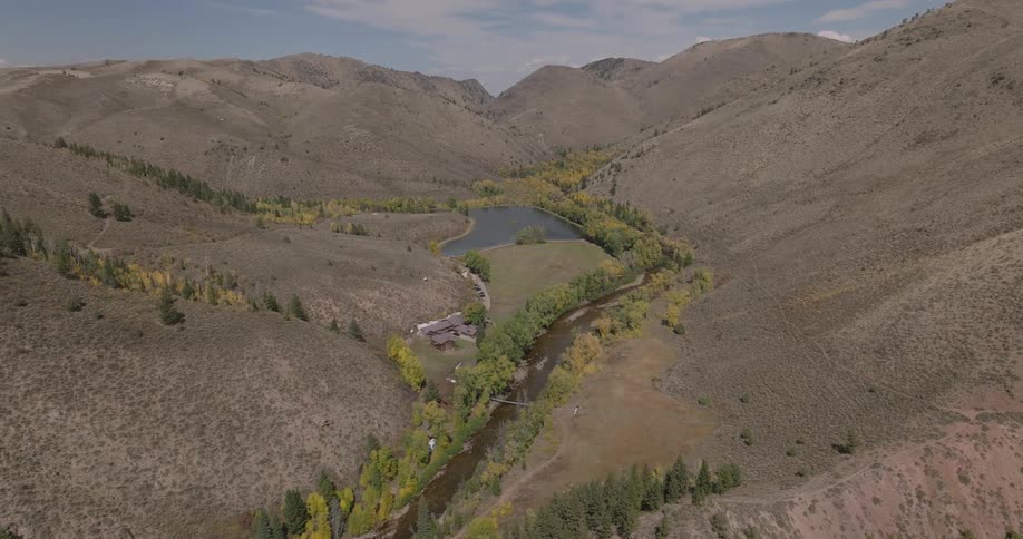A home is in the hills by a lake