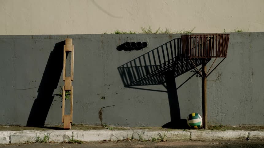 A soccer ball sits by the building