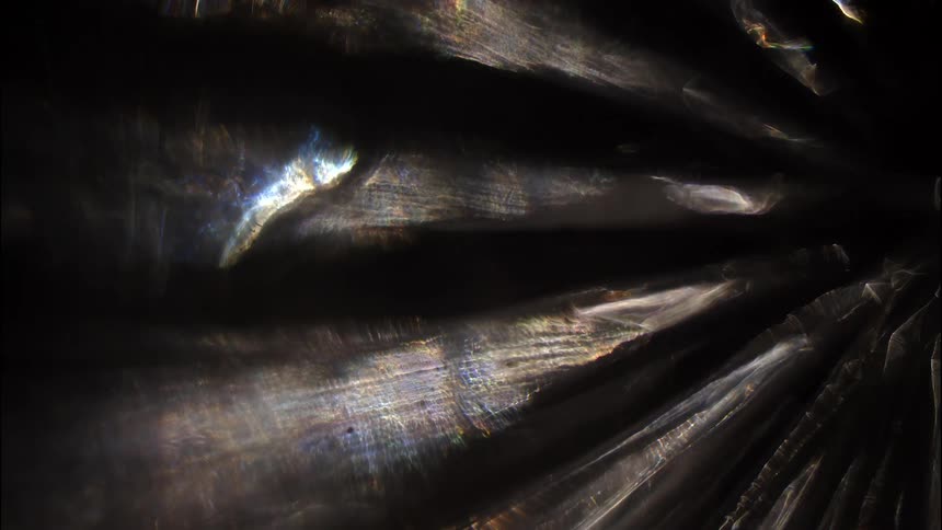 Abstract reflections against a dark background