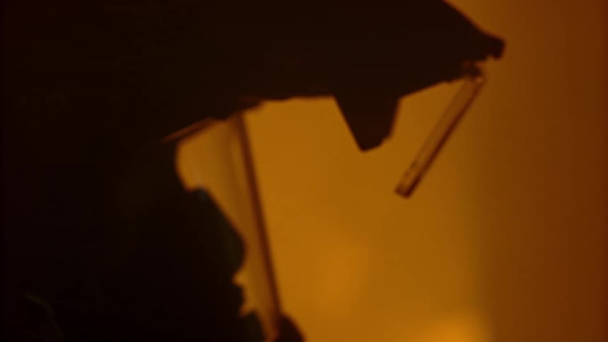 Firefighter in a burning building wears a helmet containing advanced firefighting tech