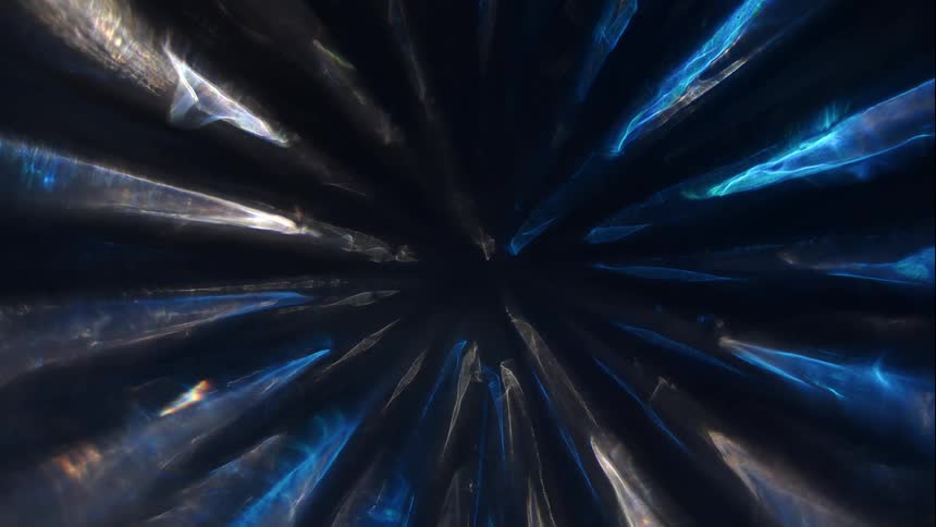 Sharp abstract pattern of light reflection against a dark background