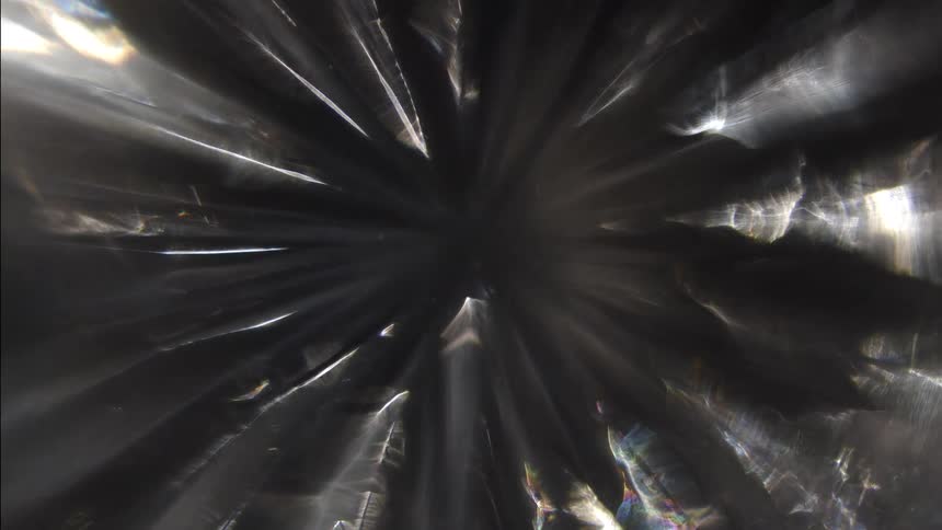 Prisms casting sharp triangles of light in a cave
