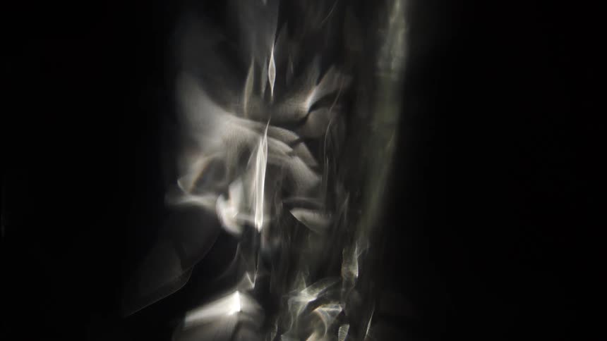 Abstract light reflections and shadows on a dark surface