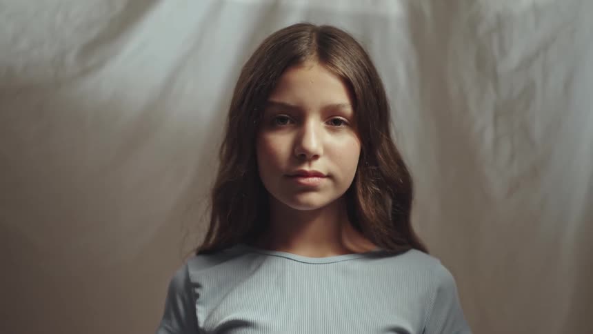 Close up portrait of a female teenager indoors during daytime