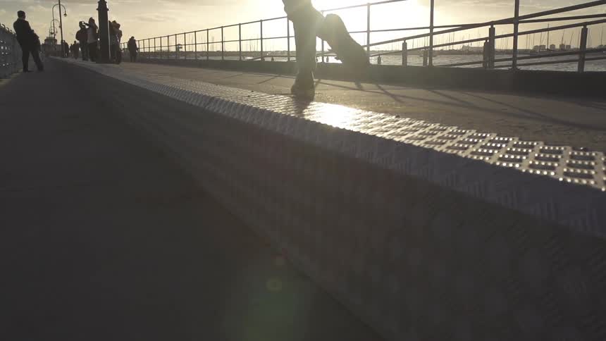A person walking down the pier