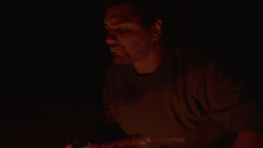 A person sitting by a campfire