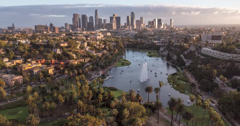 Aerial view of Echo Park Lake in Los Angeles with palm trees and a downtown skyline