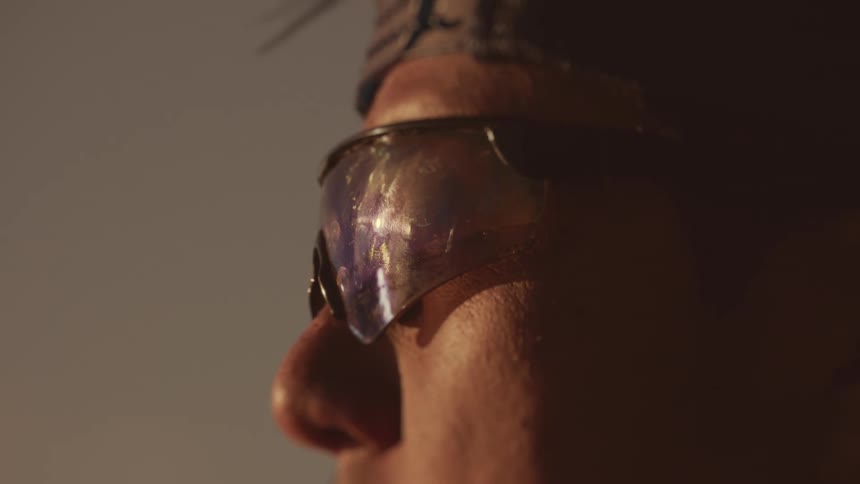 Side portrait of a man with sunglasses outdoors