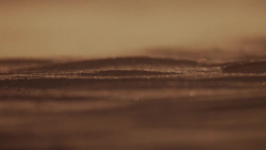 Wind blows the sand in the desert