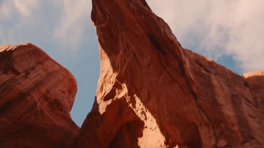Natural arches and a bridge are in the mountains