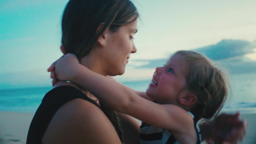 Mother and daughter share fun bonding time at the beach