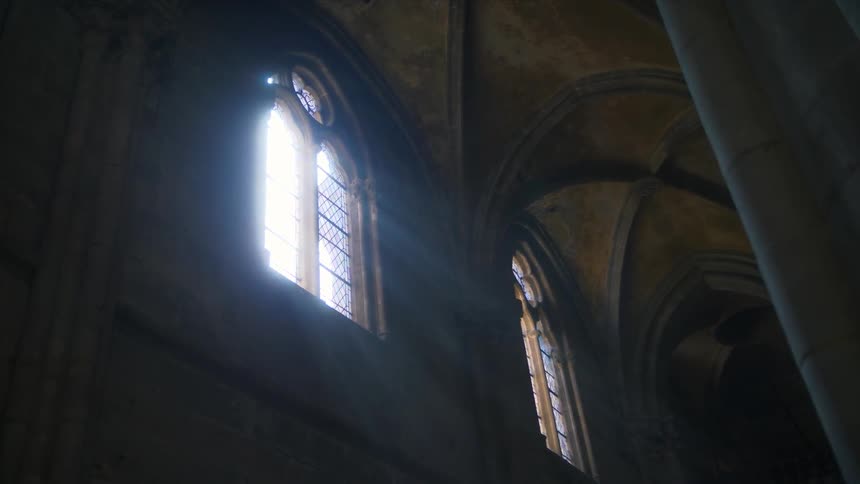 Light filters through windows in a church