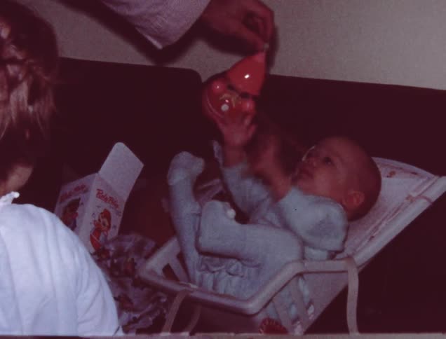 Two children play with a toy together