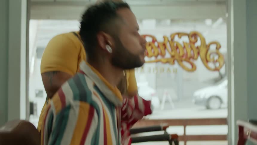A barber is talking with a client