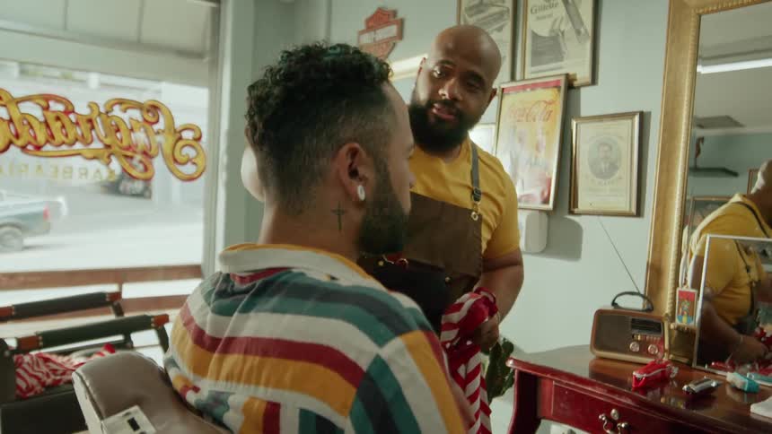 Barber finishing a customers hair