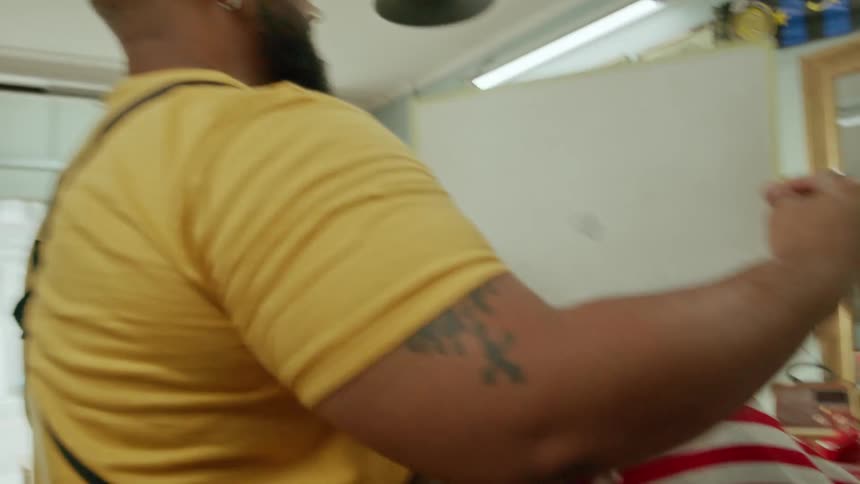 Barber showing haircut to customer