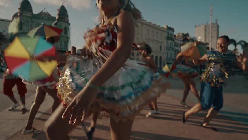 The people are dancing jumping and kicking