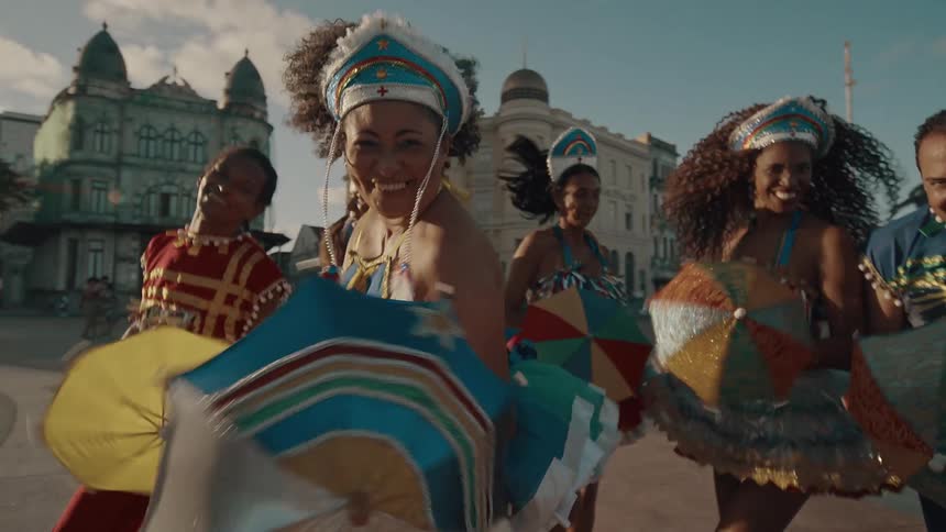 Carnival group dancing in a square