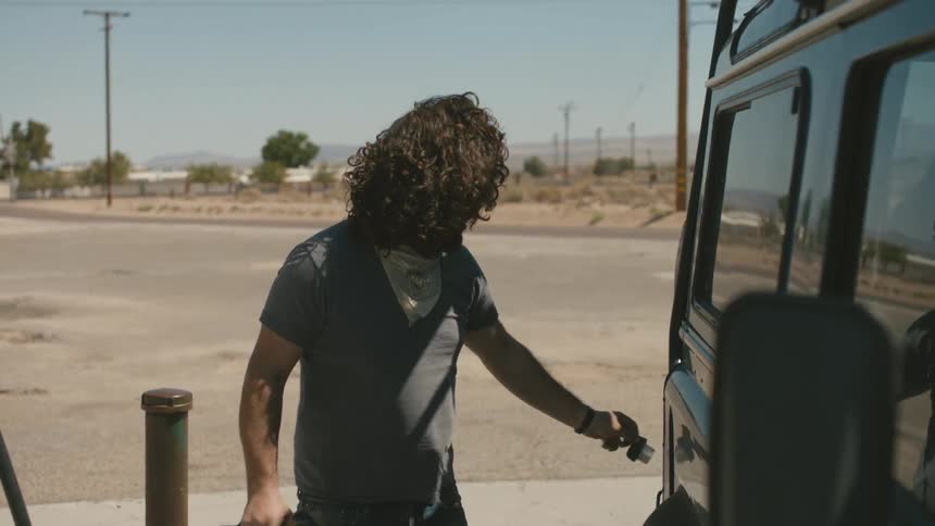 A person pumping gas