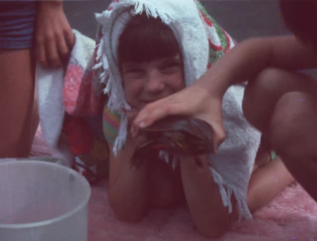 Children are playing with a turtle