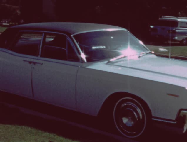 A car is parked on a residential street