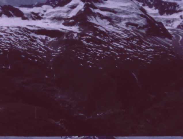 A snow capped mountain on a clear day