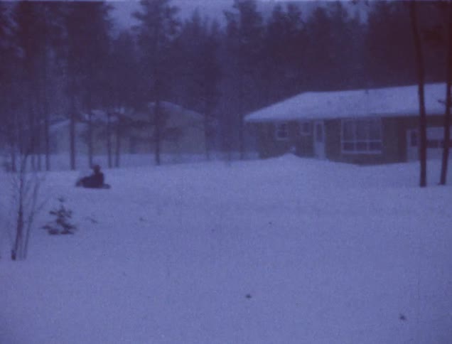 Heavy snow surrounds these homes