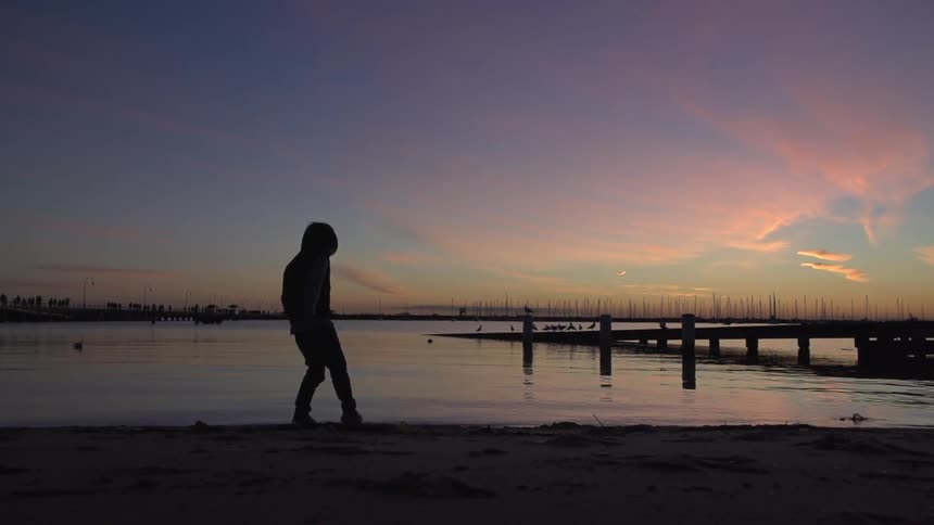 A person walking on the beach