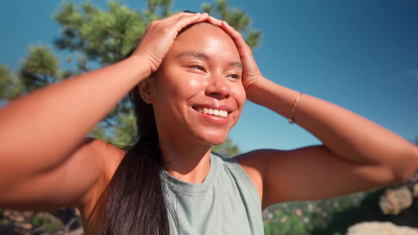 Woman with happy expression on a mountain