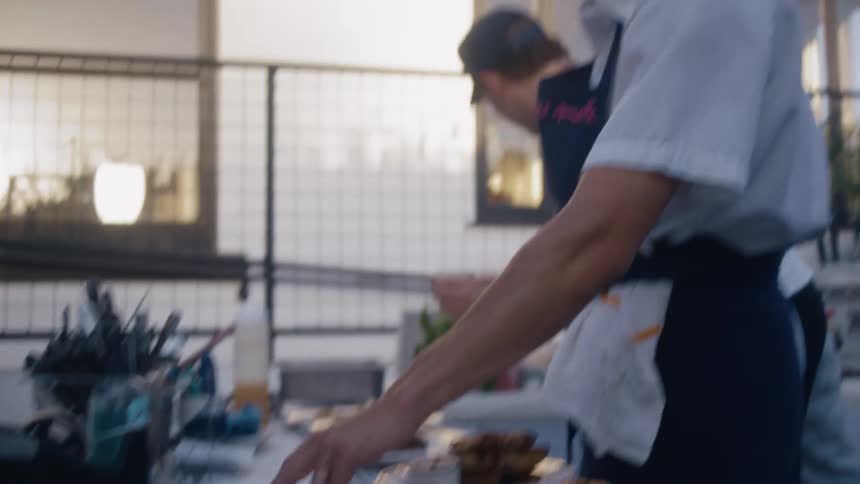 Chefs in an outdoor kitchen