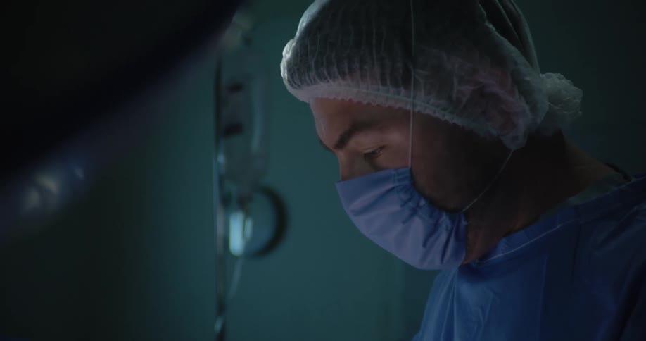 Doctor in a concentrated surgical procedure